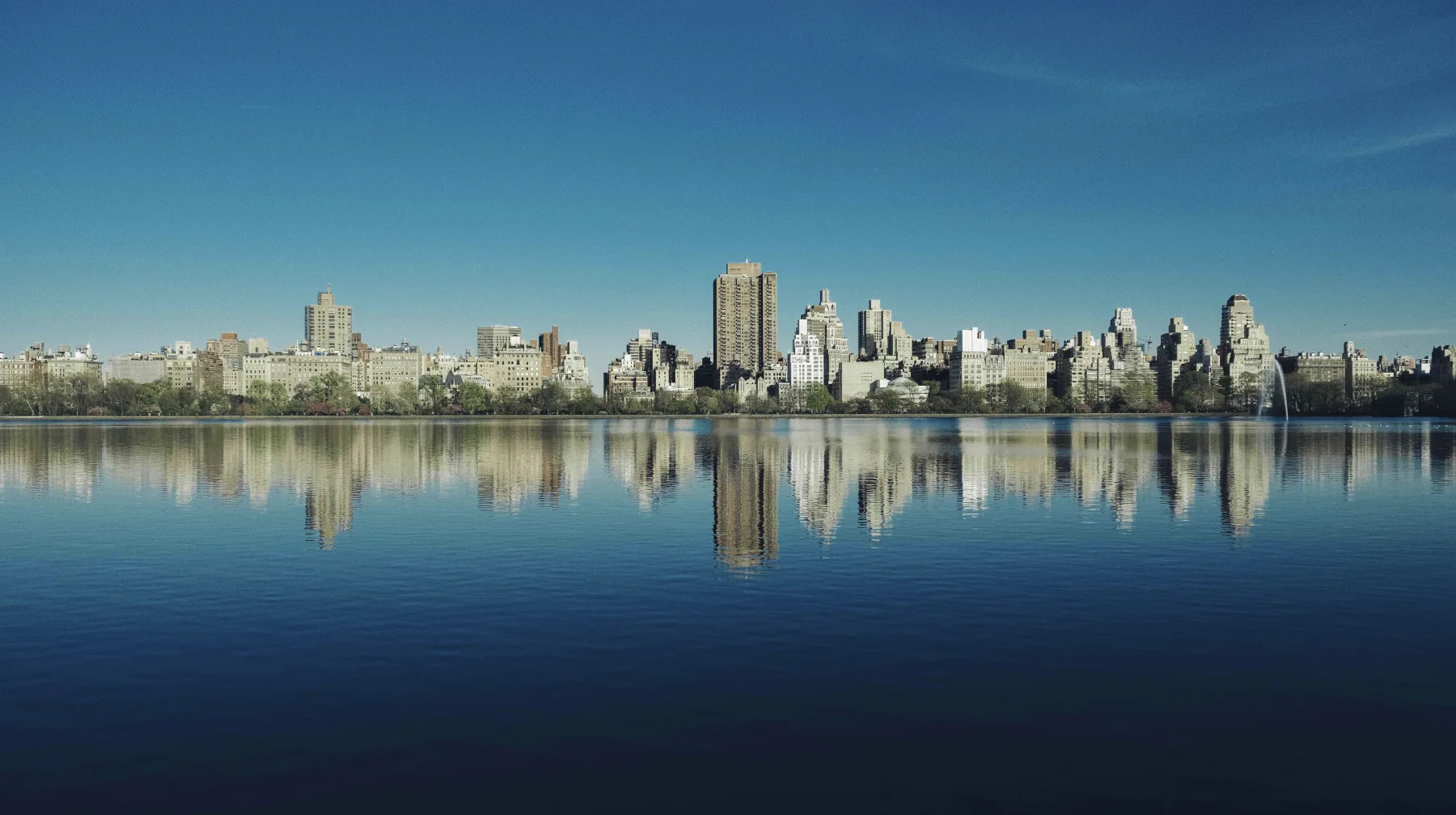 Skyline across still water