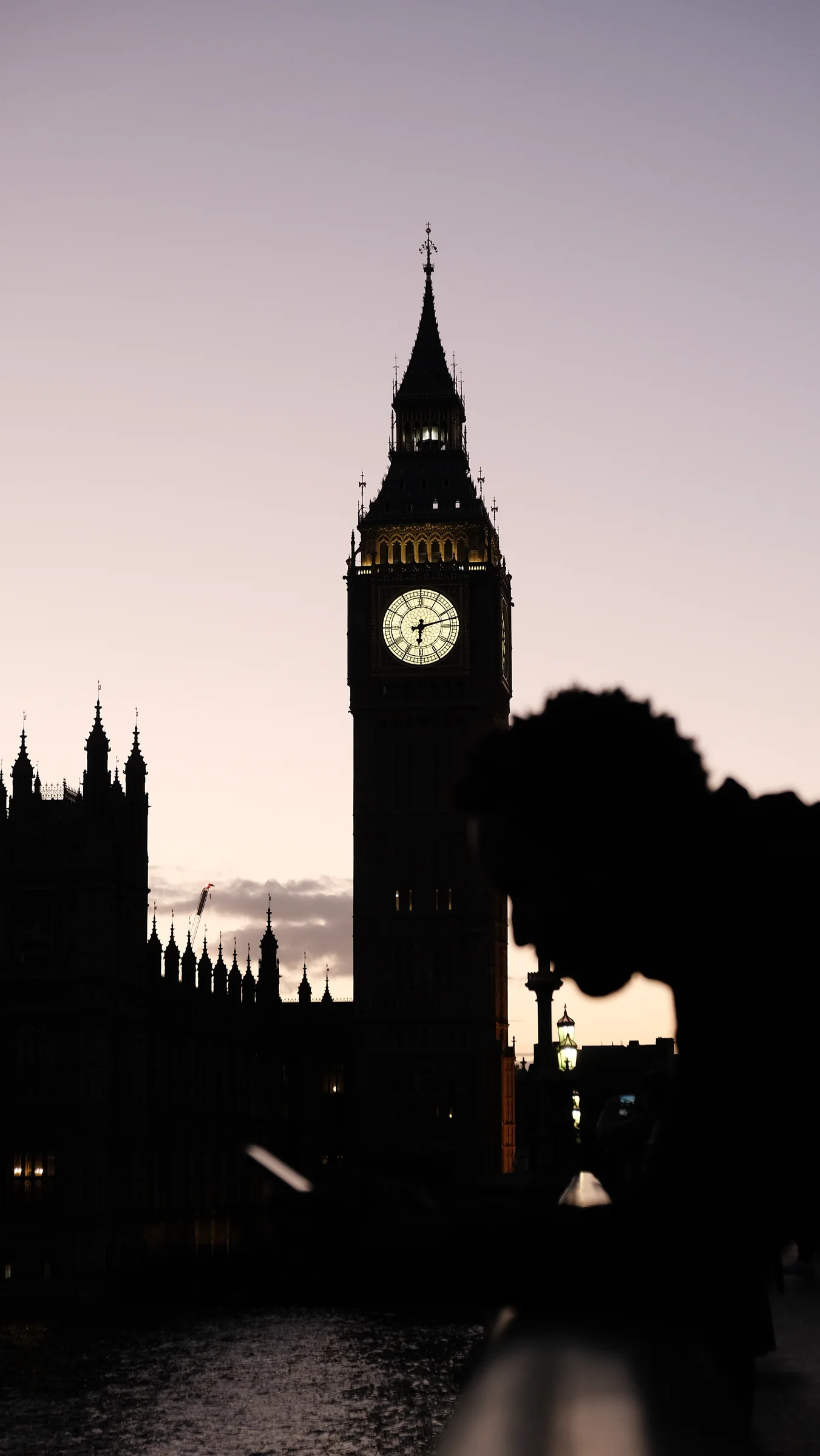 Westminster clock tower silhouette at dusk