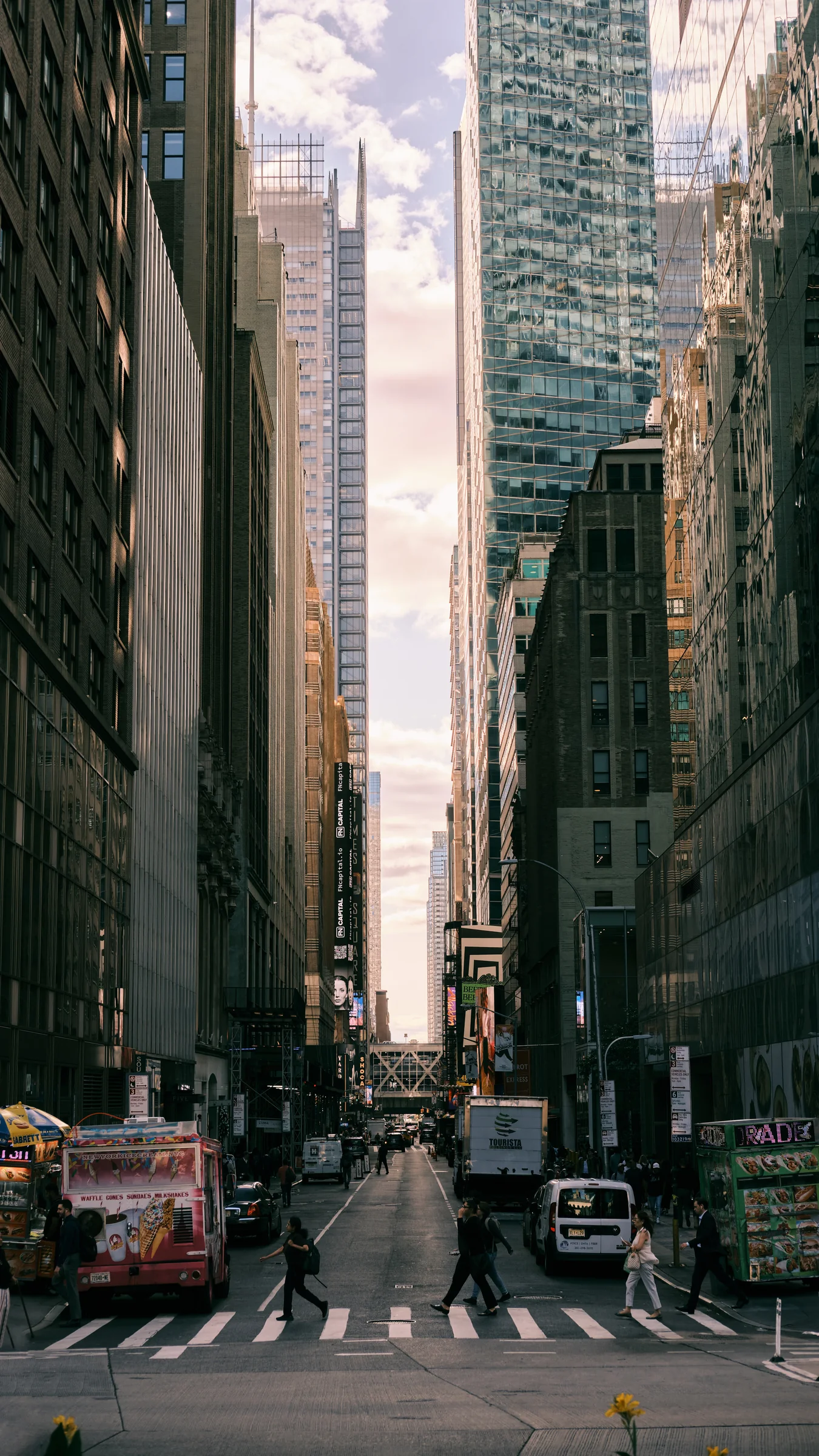 Midtown Manhattan street canyon with pedestrians